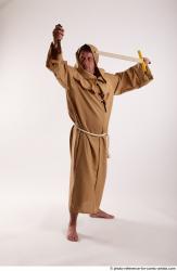 JOEL_ADAMSON WITH CRUCIFIX AND SWORD